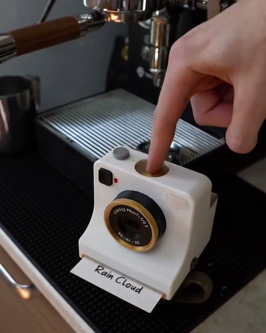 A finger pressing the LATTECAM shutter